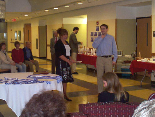 Phyllis Braun awards her student, Dan Levesque